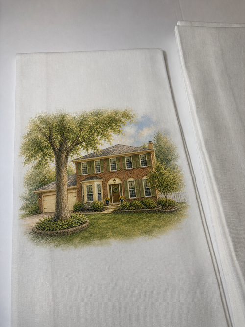 Custom tea towel with a hand drawn illustration of a two story brick house